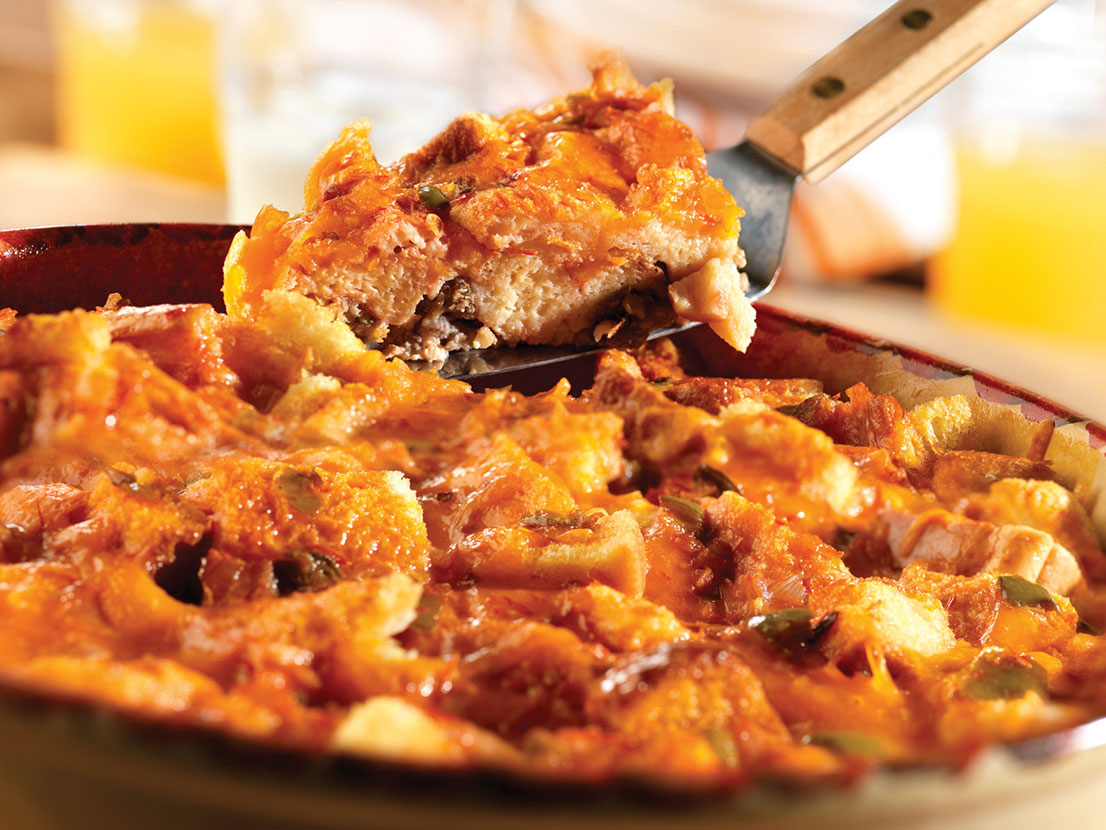 An image of prepared Fiesta Breakfast Casserole made with sausage, Pepperidge Farm® White Calcium Enriched Sliced Sandwich Bread, Cheddar cheese, Pace® Picante Sauce, eggs and milk.