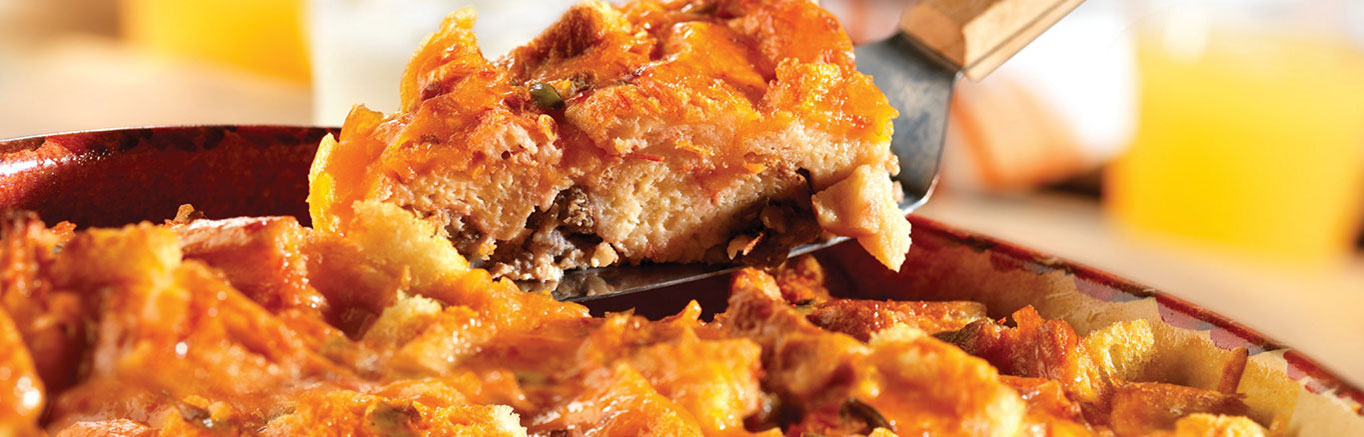 An image of prepared Fiesta Breakfast Casserole made with sausage, Pepperidge Farm® White Calcium Enriched Sliced Sandwich Bread, Cheddar cheese, Pace® Picante Sauce, eggs and milk.