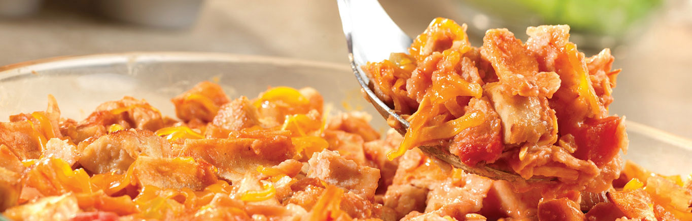 An image of prepared E-Z Chicken Tortilla Bake made with Campbell's® Condensed Tomato Soup, Pace® Chunky Salsa, milk, chicken, tortillas and Cheddar cheese.