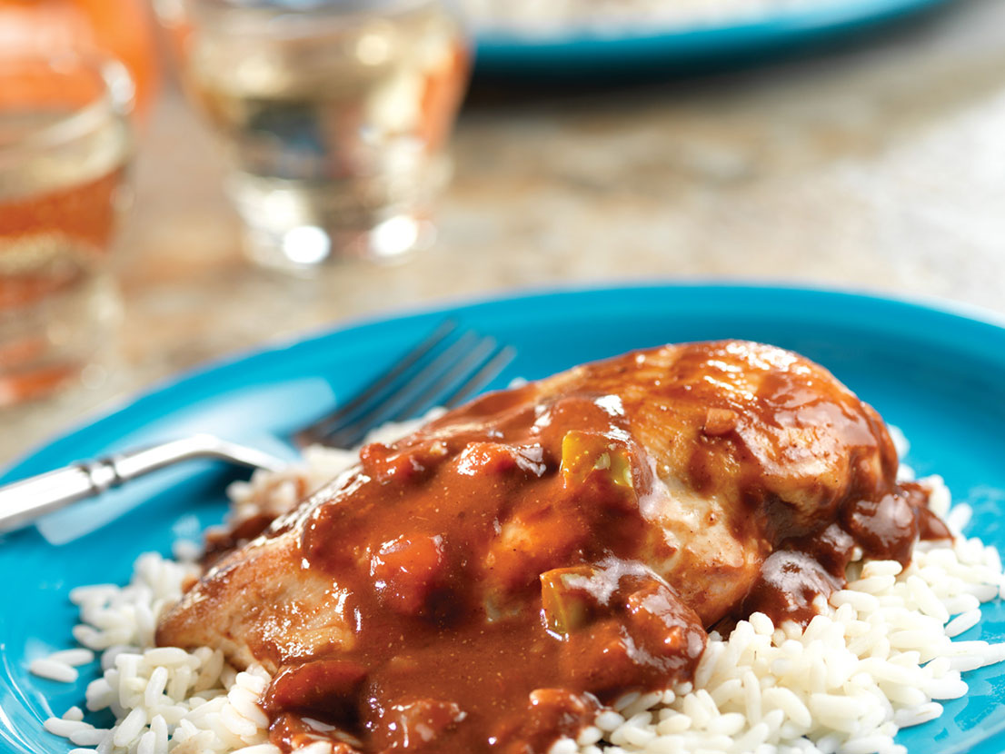 An image of Easy Chicken Molé made with chicken, tomato sauce, Pace® Picante Sauce, cocoa powder and long grain white rice.