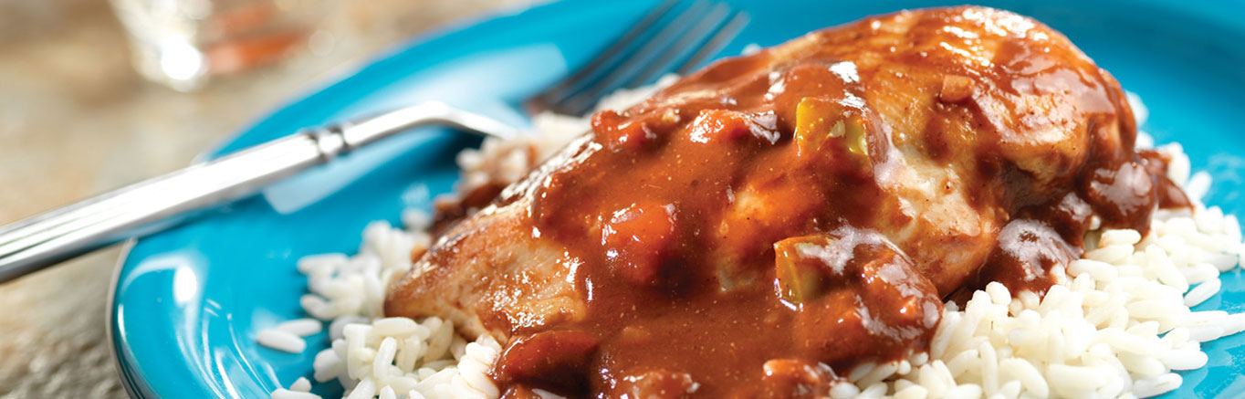 An image of Easy Chicken Molé made with chicken, tomato sauce, Pace® Picante Sauce, cocoa powder and long grain white rice.