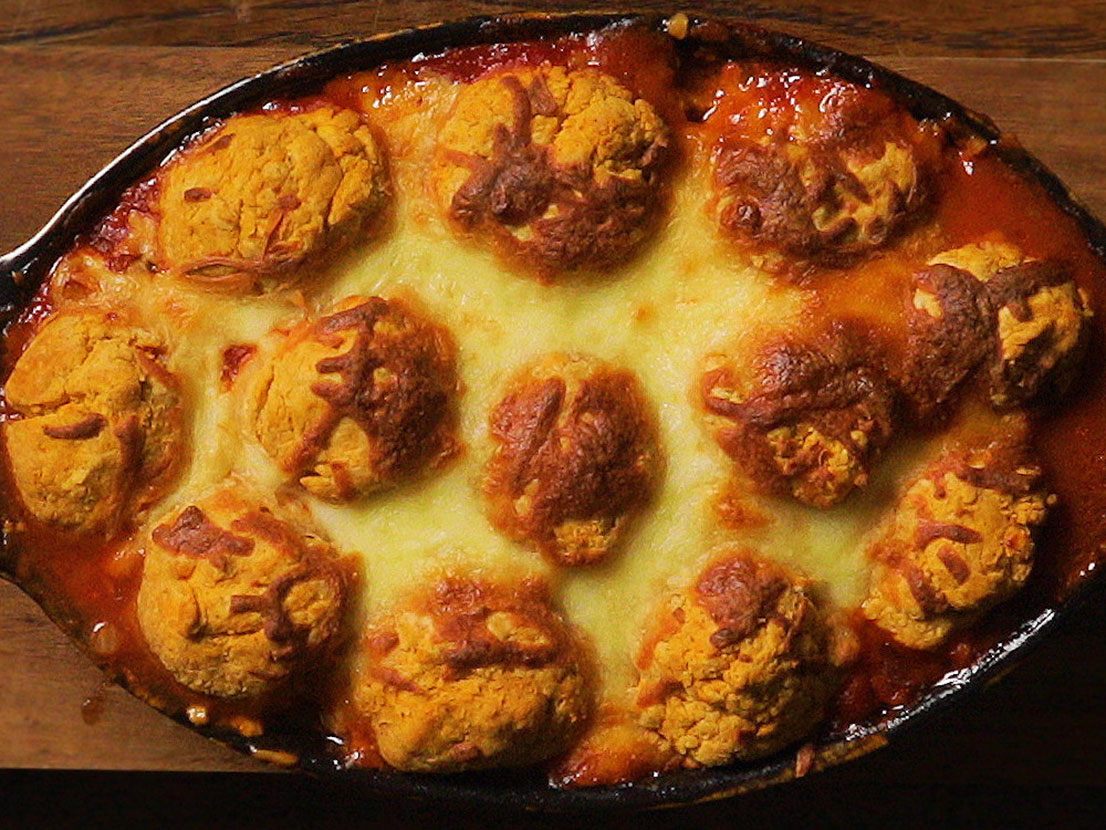 An image of prepared Baked Veggie Salsa Biscuit Cobbler made with eggplant, zucchini, yellow squash, Pace® Picante Sauce, mozzarella and biscuits.
