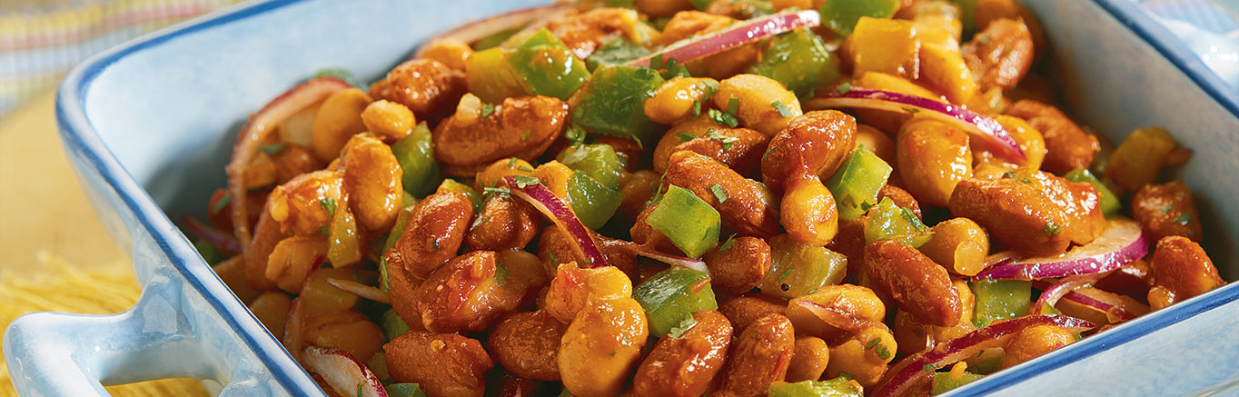 An image of prepared Best-of-the-West Bean Salad made with Pace® Picante Sauce, cilantro, lime, green bell pepper, red onion, kidney beans and pinto beans.