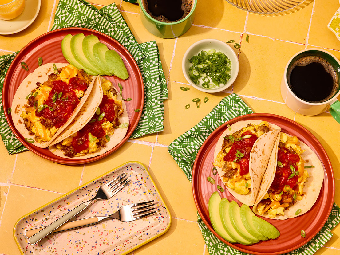 An image of prepared Breakfast Tacos made with pork sausage, eggs, Cheddar cheese, flour tortillas and Pace® Picante Sauce.