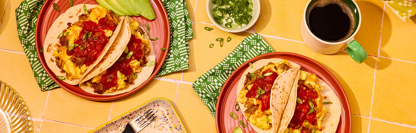 An image of prepared Breakfast Tacos made with pork sausage, eggs, Cheddar cheese, flour tortillas and Pace® Picante Sauce.