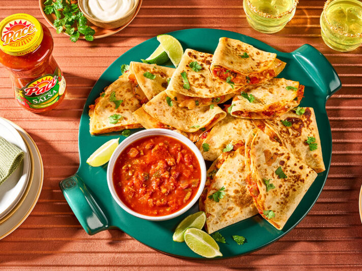 An image of prepared Quick Quesadillas made with flour tortillas, Monterey Jack cheese, green onion and Pace® Chunky Salsa or Picante Sauce.