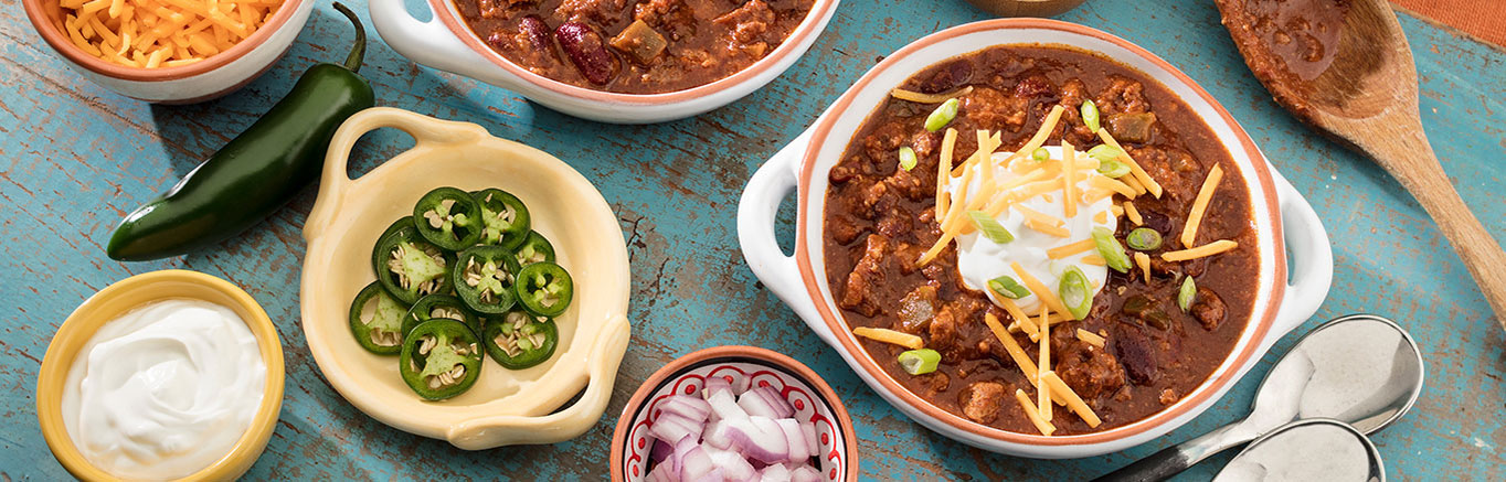 An image of prepared Slow Cooker Chili made with ground beef, chili powder, ground cumin, Pace® Chunky Salsa and kidney beans.