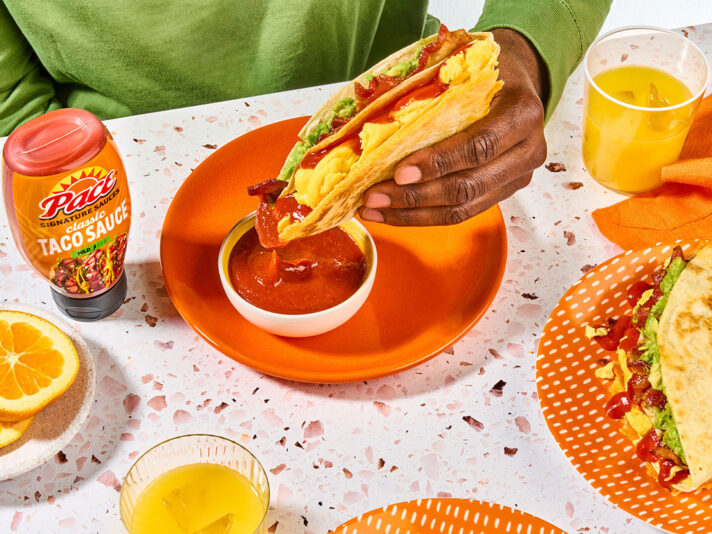 An image of prepared Folded Breakfast Quesadillas made with flour tortillas, Pace® Signature Sauces Classic Taco Sauce, Cheddar cheese, eggs, guacamole and bacon.