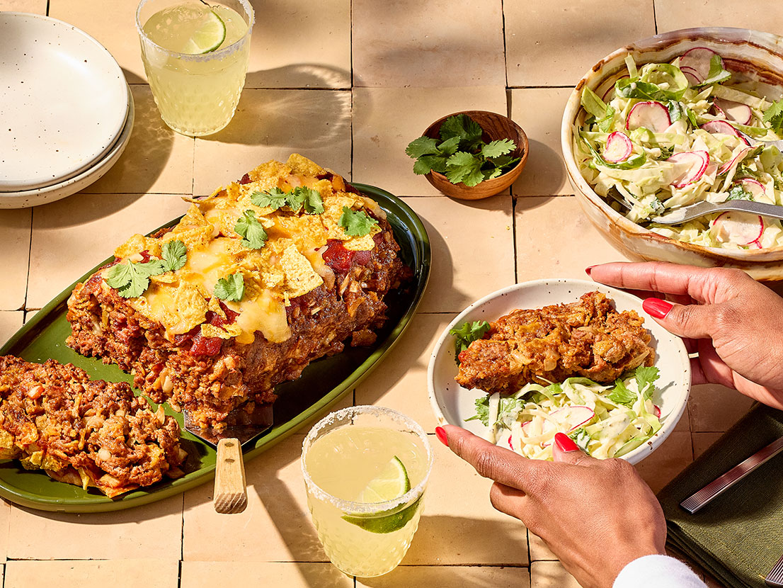 An image of prepared Mexican Meatloaf made with ground beef, onion, Mexican cheese blend, tortilla chips, Pace® Picante Sauce and Pace® Classic Taco Signature Sauce.