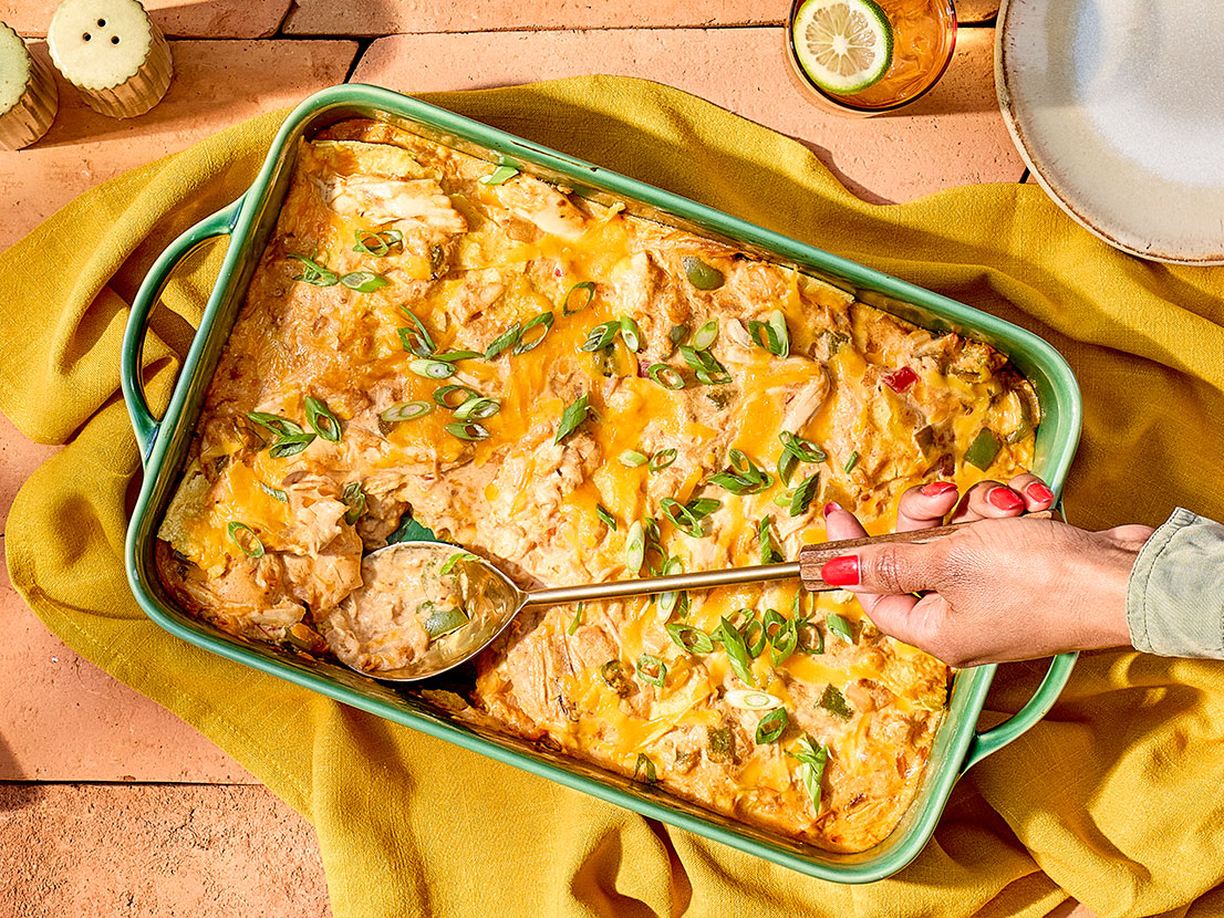 An image of prepared King Ranch Chicken Bake made with bell pepper, Campbell's® Condensed Cream of Chicken Soup, Pace® Picante Sauce, Pace® Cilantro-Jalapeño Lime Signature Sauce, sour cream, chicken, corn tortillas and Cheddar cheese.