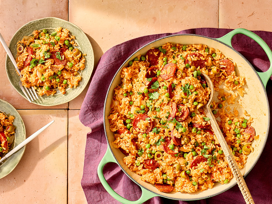 An image of prepared Chorizo & Rice Paella made with dried chorizo, white rice, Swanson® chicken broth, Pace® Picante Sauce, olives, Pace® Hot Honey Chipotle Signature Sauce and peas.