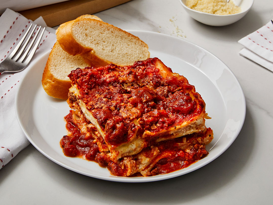 Image of prepared Classic Lasagna made with ricotta cheese, Parmesan cheese, ground beef, Prego® Traditional Italian Sauce, lasagna noodles and mozzarella cheese.