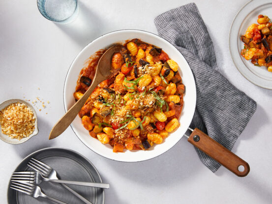 An image of prepared Creamy Tomato Gnocchi with Eggplant made with Prego® Creamy Tomato with Ricotta Sauce, Parmesan cheese, eggplant, onion, cherry tomatoes, garlic and photo gnocchi.