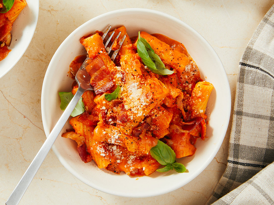 An image of prepared Spicy Rigatoni Vodka made with Prego® Spicy Vodka Sauce, rigatoni, bacon, onion and garlic.