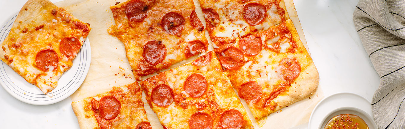 An image of prepared Spicy Vodka Pizza made with Prego® Spicy Vodka Sauce, mozzarella, Parmesan, pepperoni and basil.