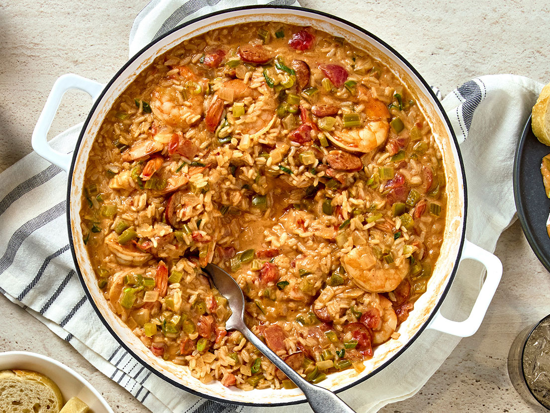 An image of prepared Creamy Cajun Jambalaya made with Swanson® Natural Goodness® Chicken Broth, rice, andouille sausage, celery, onion, green bell pepper, garlic, Prego® Cajun Alfredo Pasta Sauce, diced tomatoes, shrimp and green onions.