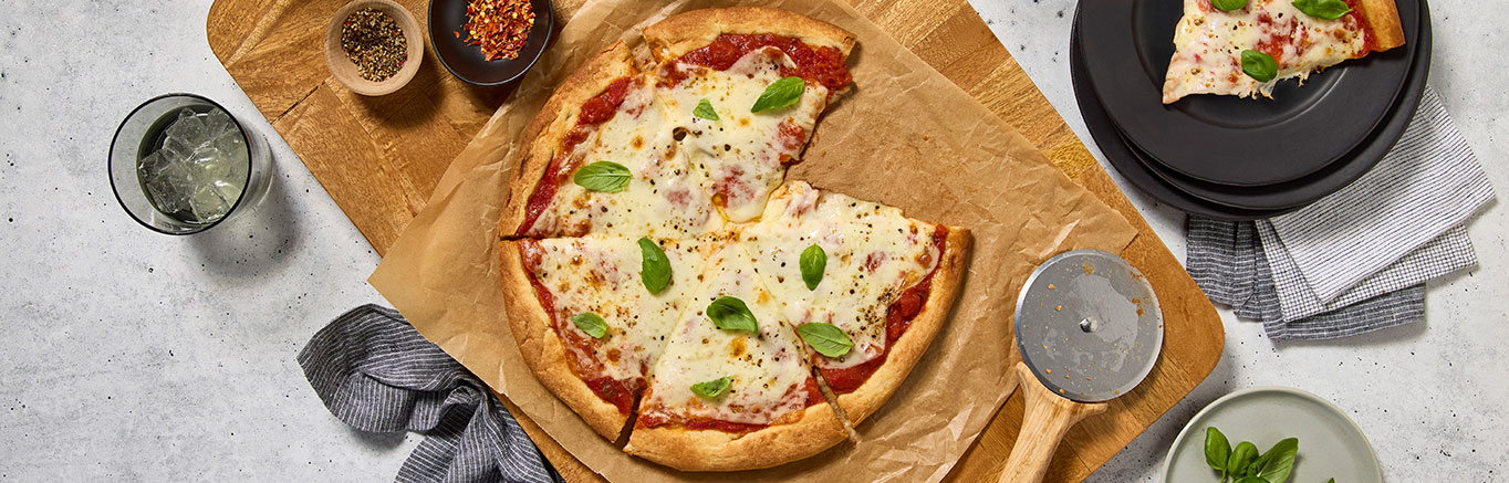 An image of prepared Margherita Pizza made with Prego® Margherita Sauce, mozzarella cheese and basil.