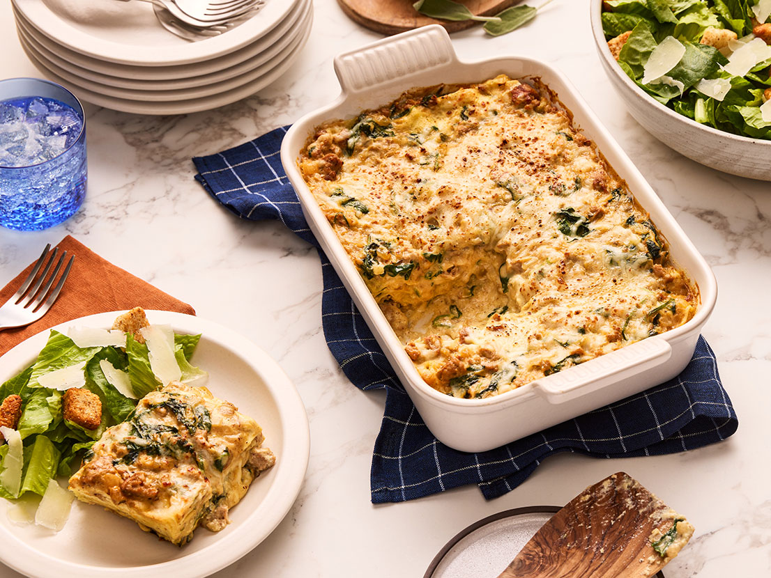 An image of prepared Creamy Butternut Squash Alfredo Lasagna made with Prego® Creamy Butternut Squash Alfredo Sauce, Italian-style turkey sausage, baby spinach, ricotta, Parmesan and ground sage.