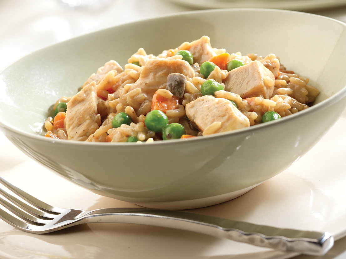 An image of prepared Chicken Marsala made with chicken breast, shallots, mushrooms, Marsala wine, Swanson® Chicken Broth, parsley and fettuccine pasta.