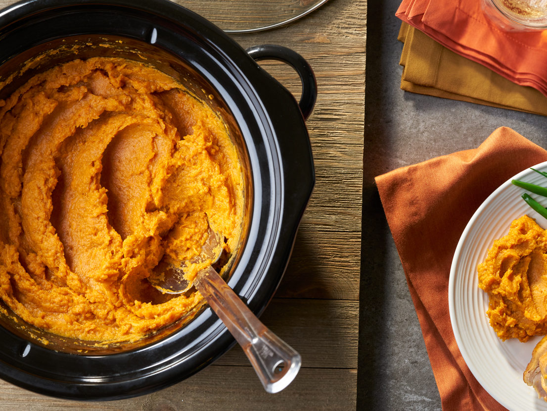 An image of prepared Easy Slow Cooker Mashed Sweet Potatoes made with sweet potatoes, Swanson® Chicken Broth, butter, brown sugar and cinnamon.