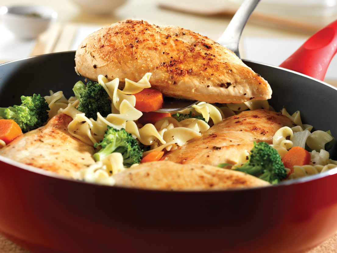 An image of prepared Quick Chicken & Noodles made with chicken, Swanson® Chicken Broth or Chicken Stock, California vegetable blend and egg noodles.