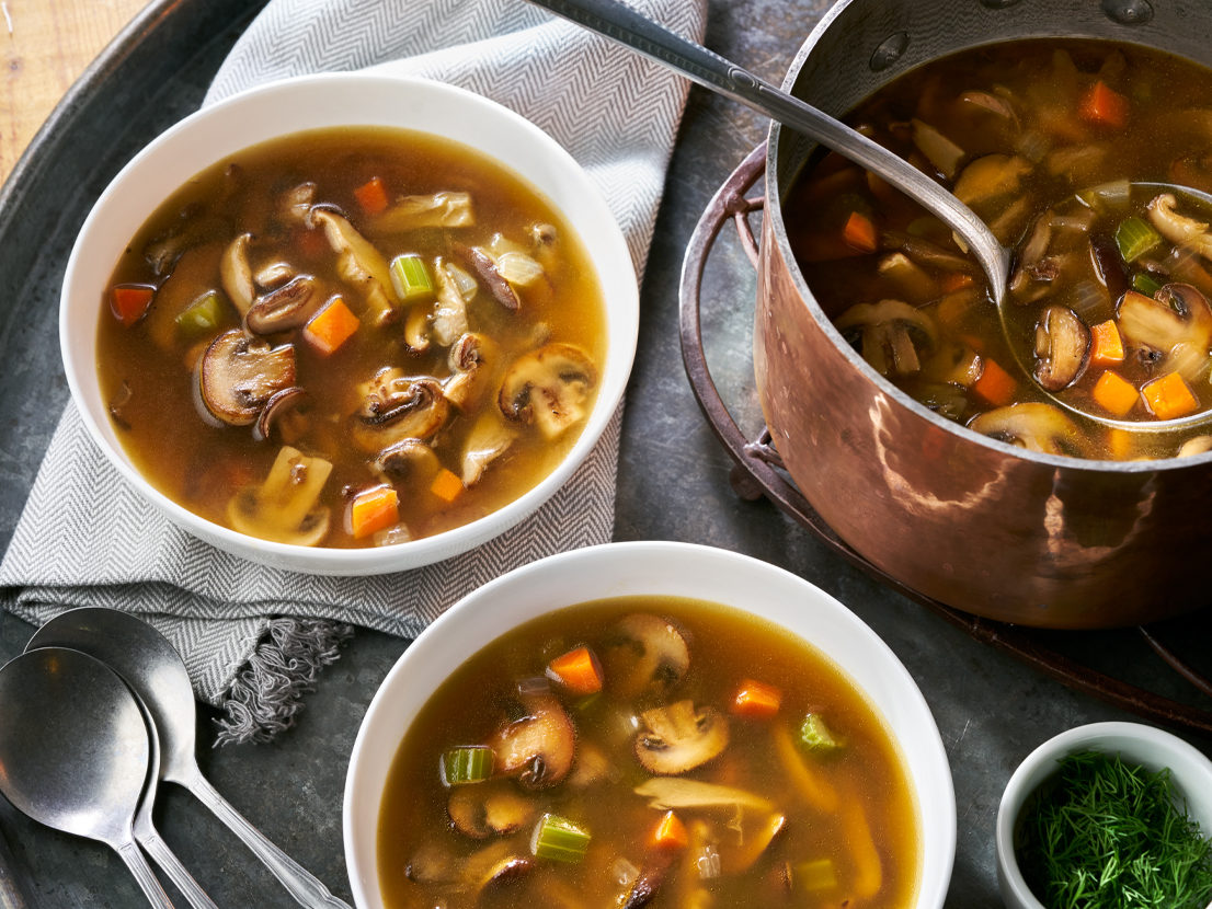 An image of prepared Wild Mushroom Soup made with mushrooms, onion, carrot, celery, Swanson® Vegetable Broth and fresh dill.