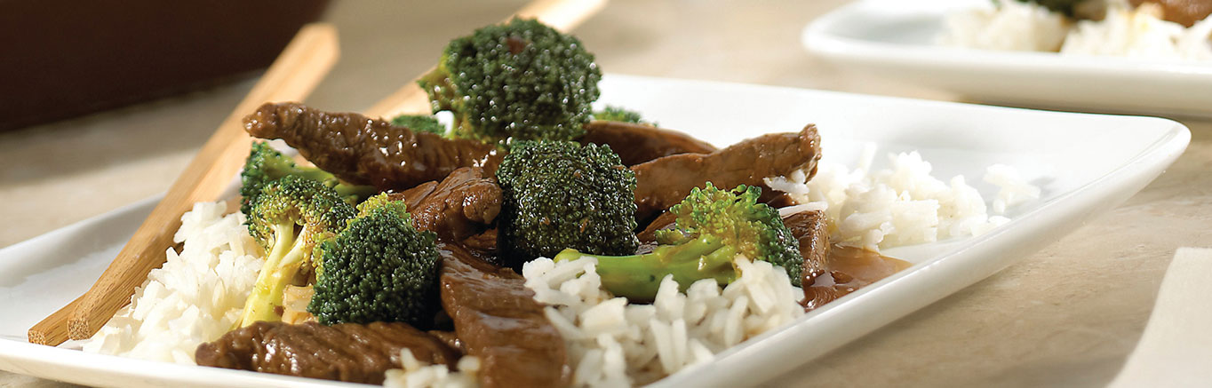An image of prepared Beef Teriyaki made with Swanson® Beef Broth, beef sirloin steak, broccoli and long grain white rice.