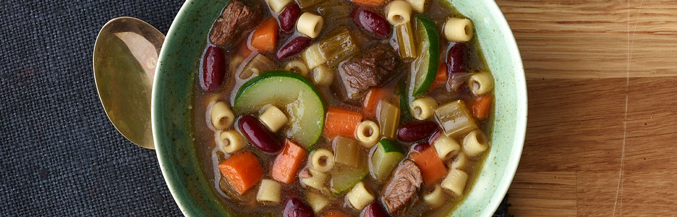 An image of prepared Beef Vegetable Soup 3-Ways made with beef sirloin steak, onion, celery, carrot and Swanson® Beef Broth.
