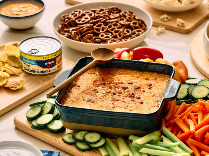 An image of prepared Buffalo Chicken Dip made with Campbell's® Condensed Spicy Buffalo-Style Cream of Chicken Soup, Swanson® Premium White Chunk Chicken Breast and Monterey Jack cheese.