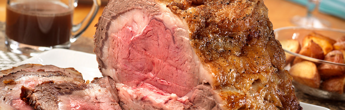 An image of prepared Classic Standing Beef Rib Roast made with beef rib roast, red wine and Swanson® Beef Stock.