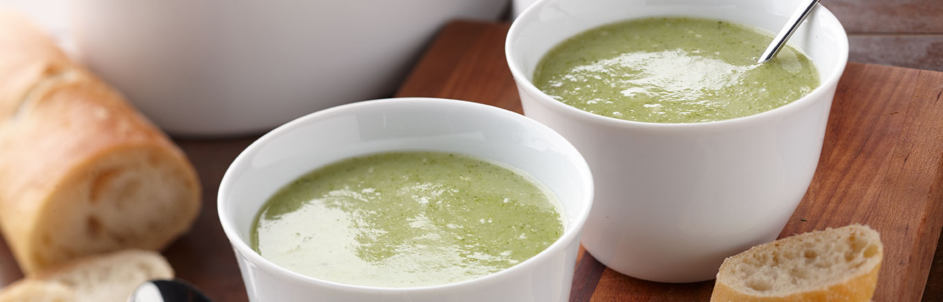 An image of prepared Creamy Broccoli Potato Soup made with Swanson® Chicken Broth, broccoli, potatoes and Parmesan cheese.