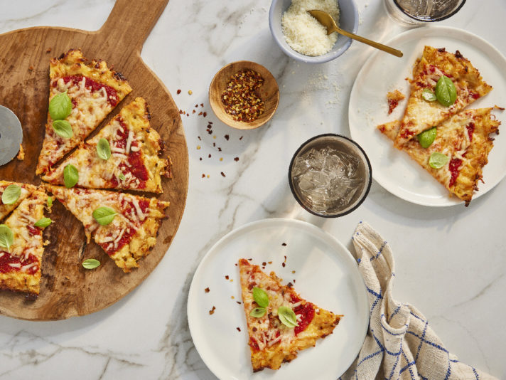 An image of prepared Keto-Friendly Chicken Crust Pizza made with Swanson® Premium White Chicken Breast, mozzarella cheese, Parmesan cheese and Prego® Traditional No Sugar Added Italian Sauce.