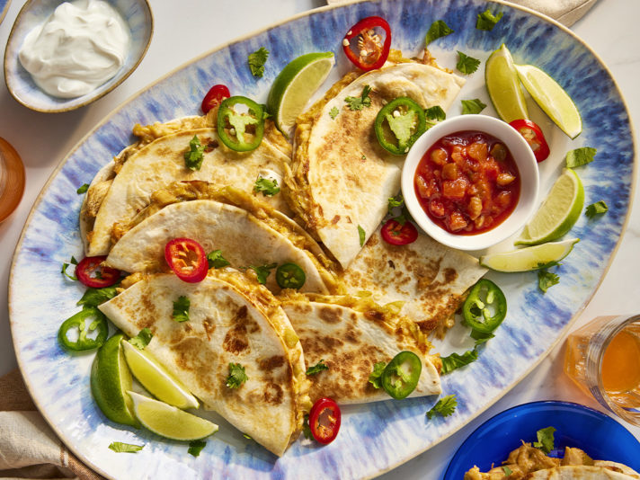 An image of prepared Monterey Jack Chicken Quesadillas made with Swanson® Premium White Chicken Breast in Water, Monterey Jack cheese, Pace® Chunky Salsa, green chiles and tortillas.