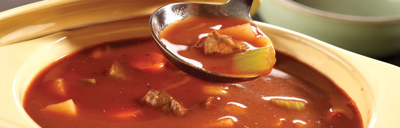 An image of prepared Hearty Vegetable Beef Soup made with beef sirloin steak, V8® 100% Vegetable Juice, Swanson® Beef Broth, potato, carrot, onion and celery.