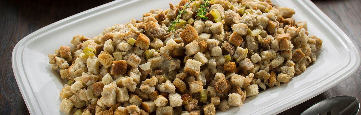 An image of prepared Holiday Slow Cooker Stuffing made with butter, Pepperidge Farm® Herb Seasoned Cubed Stuffing, celery, onions and Swanson® Natural Goodness® Chicken Broth.
