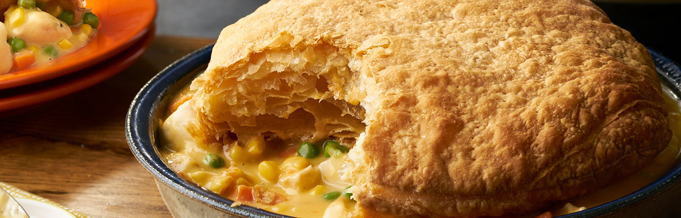 Image of prepared Instant Pot® Chicken Pot Pie made with Pepperidge Farm® Puff Pastry, chicken. Swanson® Chicken Broth, Campbell's® Condensed Cream of Chicken Soup, mixed vegetables and Cheddar cheese.