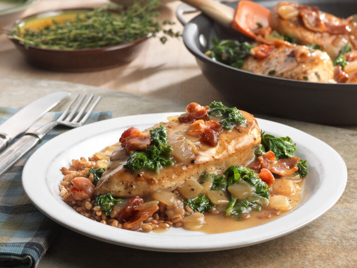 An image of prepared Maple Glazed Chicken with Bacon & Kale made with bacon, chicken, Swanson® Organic Chicken Stock, pure maple syrup and kale.