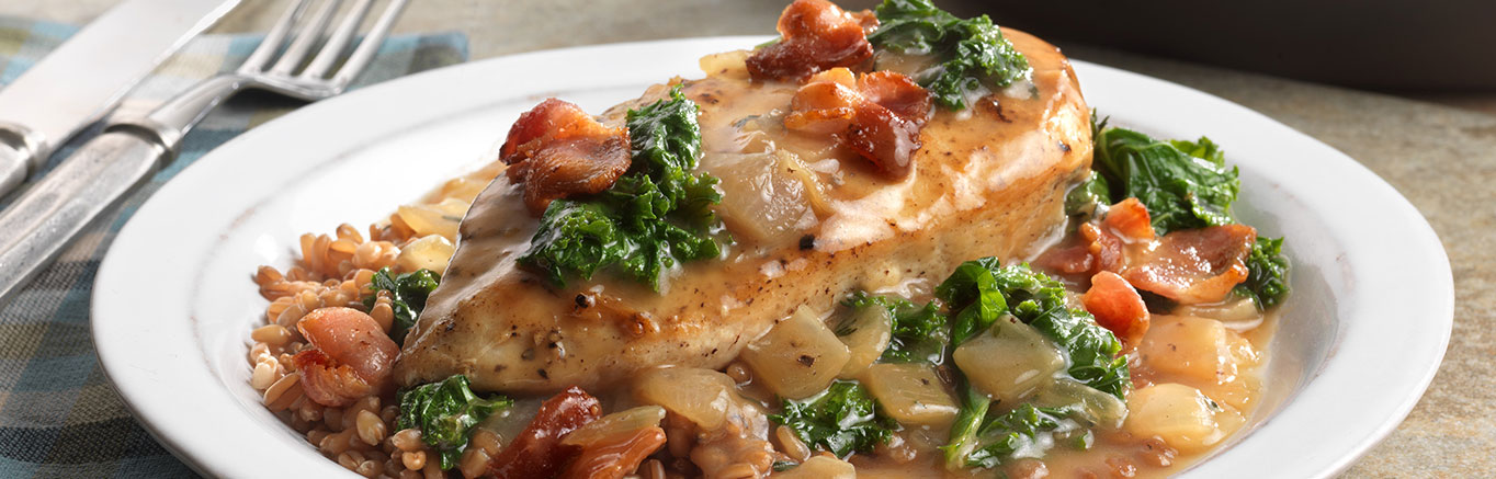 An image of prepared Maple Glazed Chicken with Bacon & Kale made with bacon, chicken, Swanson® Organic Chicken Stock, pure maple syrup and kale.