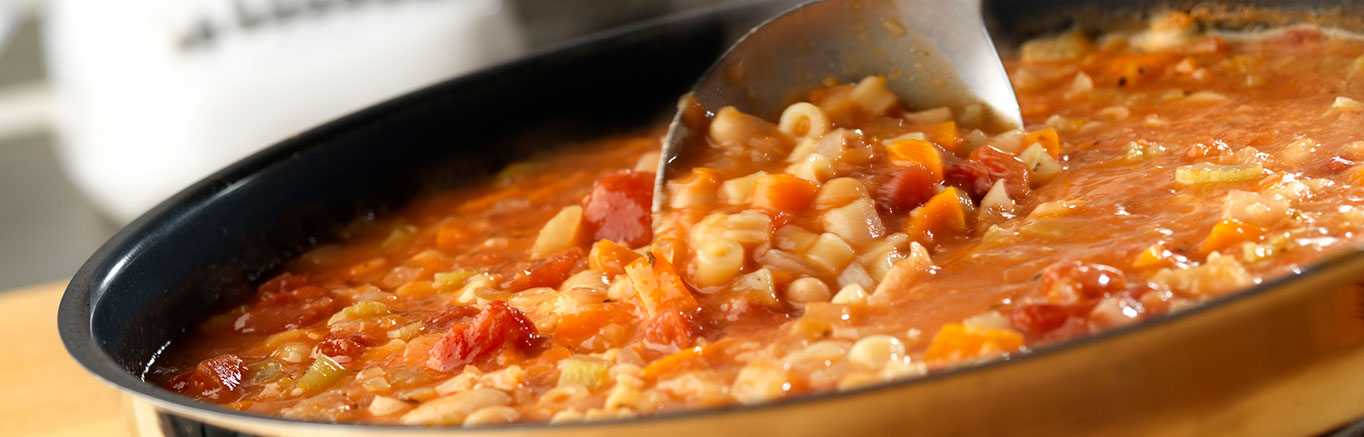 An image of prepared Pasta e Fagioli made with Swanson® Chicken Broth, canned tomatoes, ditalini and cannellini beans.