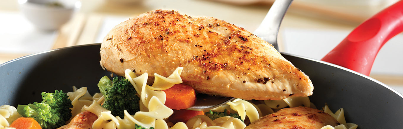 An image of prepared Quick Chicken & Noodles made with chicken, Swanson® Chicken Broth or Chicken Stock, California vegetable blend and egg noodles.
