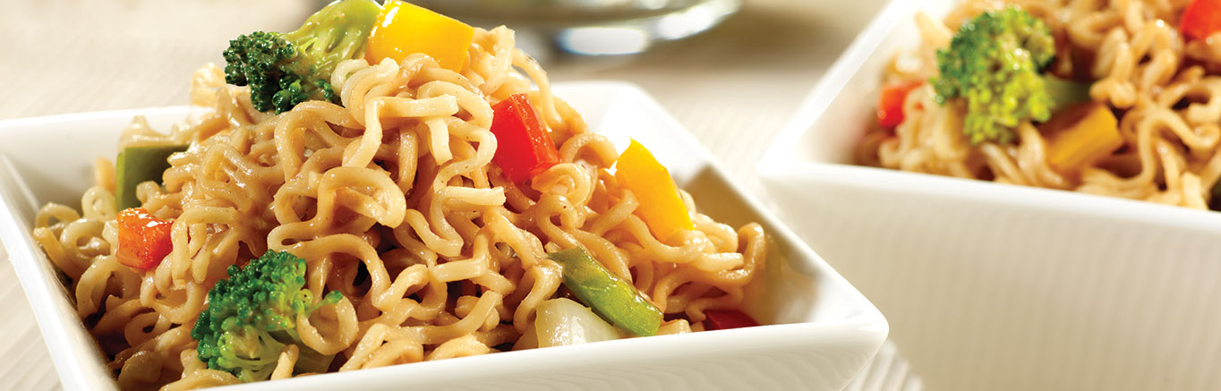 An image of prepared Ramen Noodle Broccoli Salad made with ramen noodles, broccoli, peanut butter, Swanson® Chicken Broth, soy sauce, sriracha hot chili sauce, bell pepper, onion and garlic.