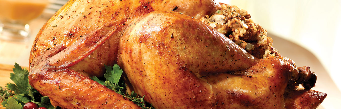 An image of prepared Roast Turkey with Mushroom Stuffing made with Swanson® Chicken Stock, herbs, mushrooms, Pepperidge Farm® Herb Seasoned Stuffing and turkey.