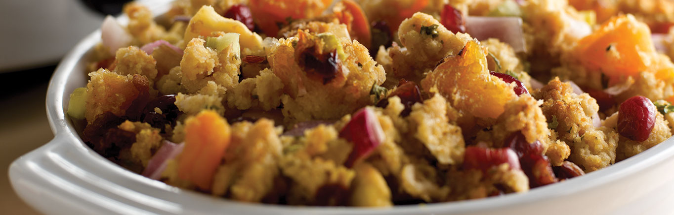 An image of prepared Slow Cooker Cornbread Stuffing with Dried Fruit & Herbs made with mixed dried fruit, celery, onion, Swanson® Chicken Broth and Pepperidge Farm® Cornbread Classic Stuffing.