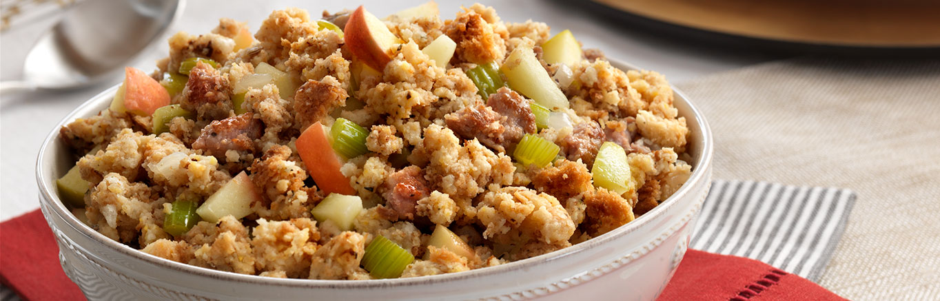 An image of prepared Sausage & Apple Stuffing made with Swanson® Chicken Broth, celery, onion, apples, pork sausage, Pepperidge Farm® Herb Seasoned Stuffing and Pepperidge Farm® Cornbread Stuffing.