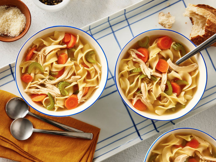 An image of prepared Sensational Chicken Noodle Soup made with Swanson® Chicken Broth, carrot, celery, egg noodles and cooked chicken or turkey.