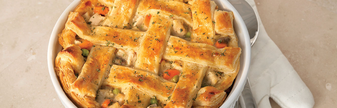 An image of The Ultimate Chicken Pot Pie made with Pepperidge Farm® Puff Pastry Sheets, butter, carrots, onions, mushrooms, Swanson® Chicken Broth or Chicken Stock, thyme, cooked chicken and peas.