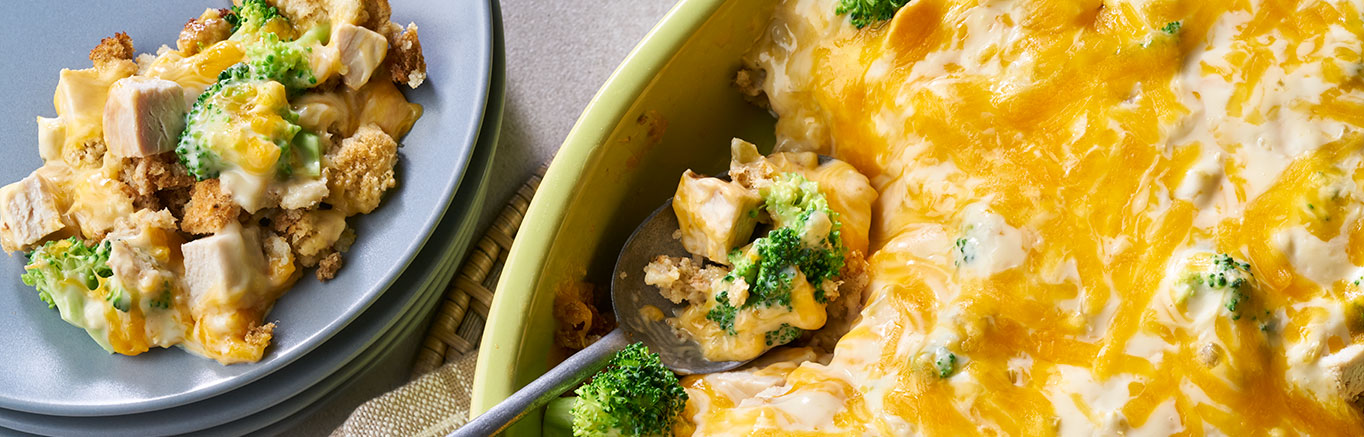 An image of prepared Turkey Stuffing Divan made with Swanson® Unsalted Chicken Stock, butter, Pepperidge Farm® Herb Seasoned Stuffing, broccoli, cooked turkey or chicken, Campbell's® Condensed Cream of Celery Soup, milk or Cheddar cheese.