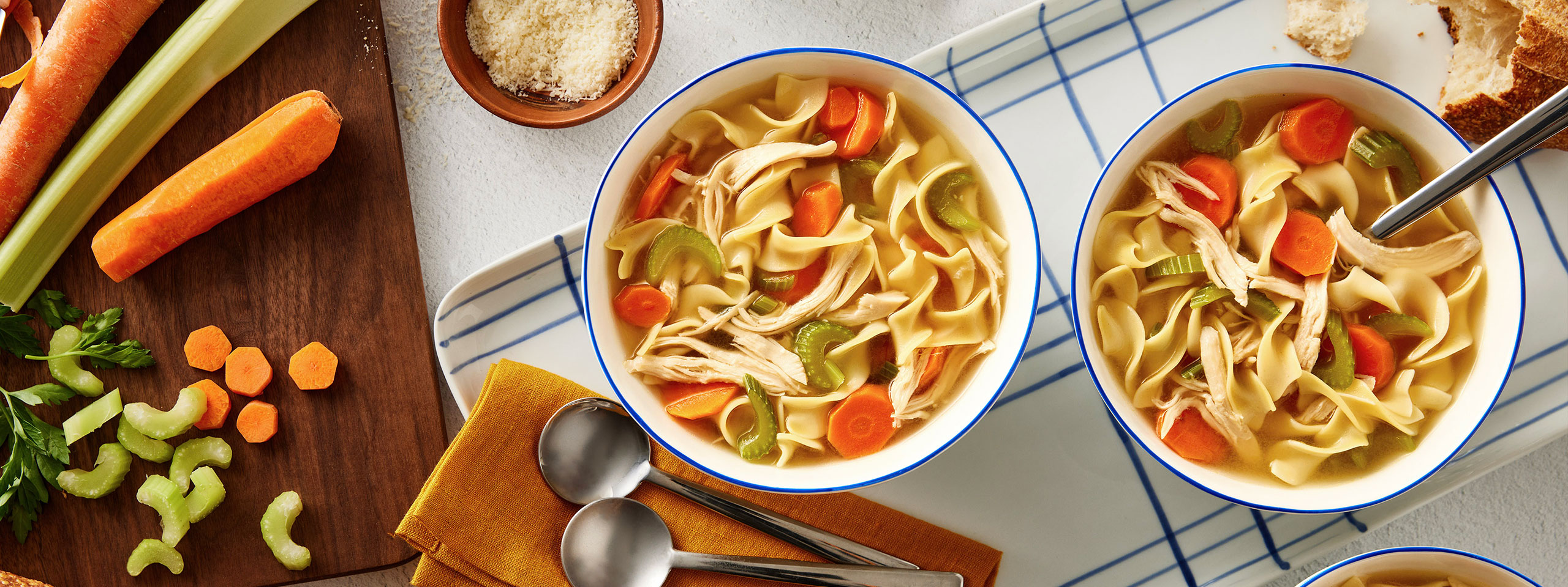 An image of prepared Sensational Chicken Noodle Soup made with Swanson® Chicken Broth, carrot, celery, egg noodles and cooked chicken or turkey.