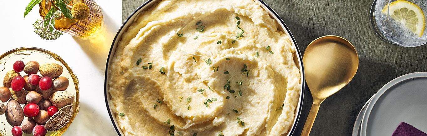 An image of prepared Extra Creamy Mashed Potatoes made wit Swanson® Chicken Broth, potatoes, cream cheese, light cream or half and half and butter.