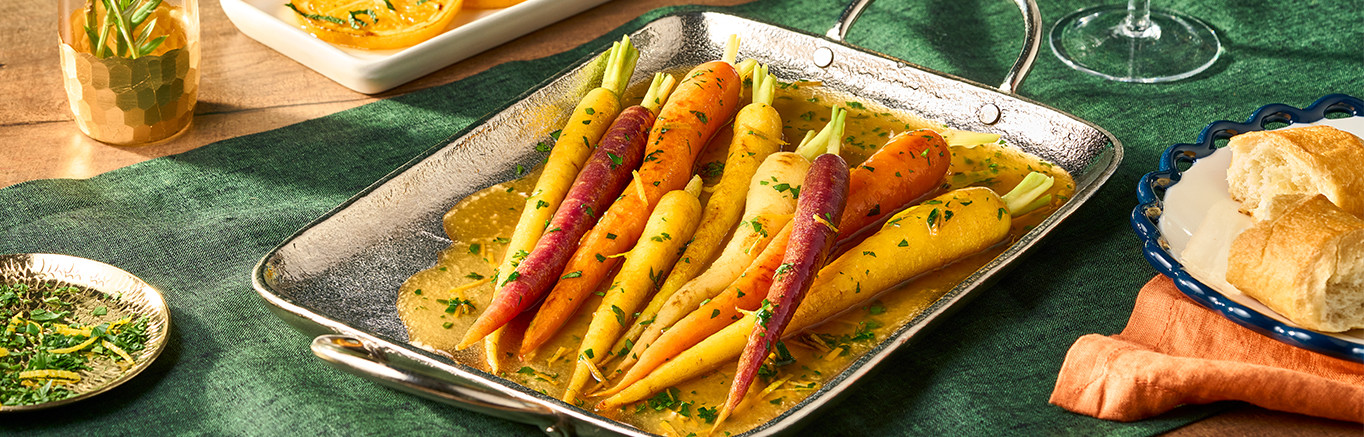 An image of prepared Spicy Citrus Carrots in Honey Glaze made with carrots, Swanson® Spicy Chicken Broth, honey, brown sugar and orange zest.